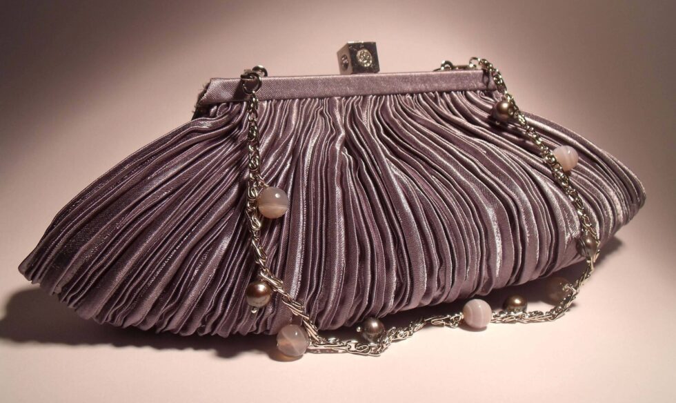 Gray satin clutch with pleated pattern with chain and gray pearls and agate