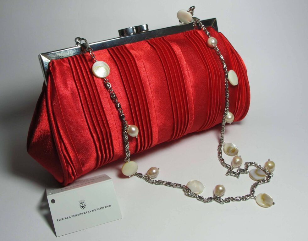 Satin clutch with mother of pearl and white pearls