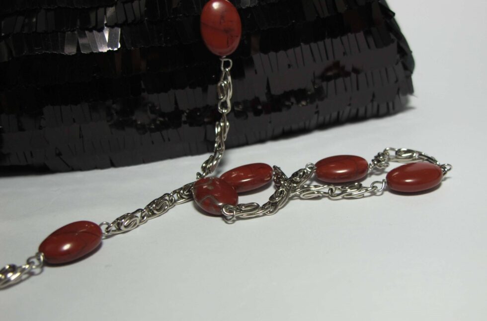 Mini-clutch with pailletes and red jasper