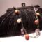 Black satin clutch with pleated pattern, pearls, amethyst and madrepora