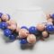 Necklace in cotton with "grapes" of blue and pink ceramic