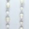 Long earrings with white baroque freshwater pearls