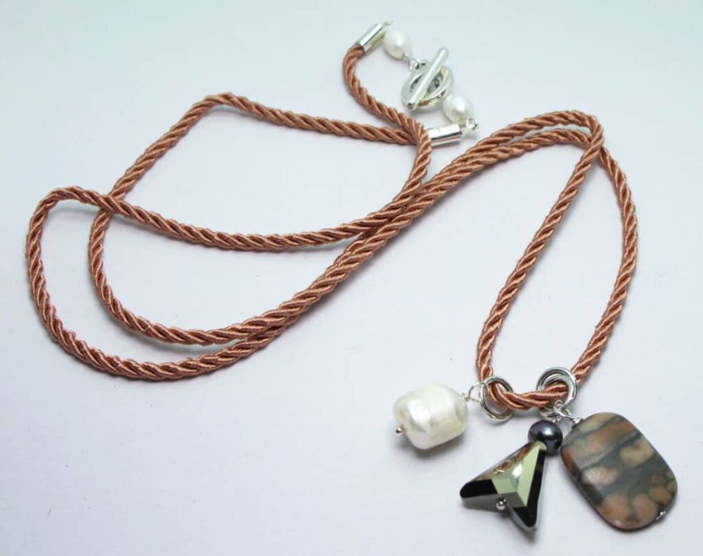 Pink silk necklace with baroque pearl, jasper, peacock pearl and Swarovski crystal