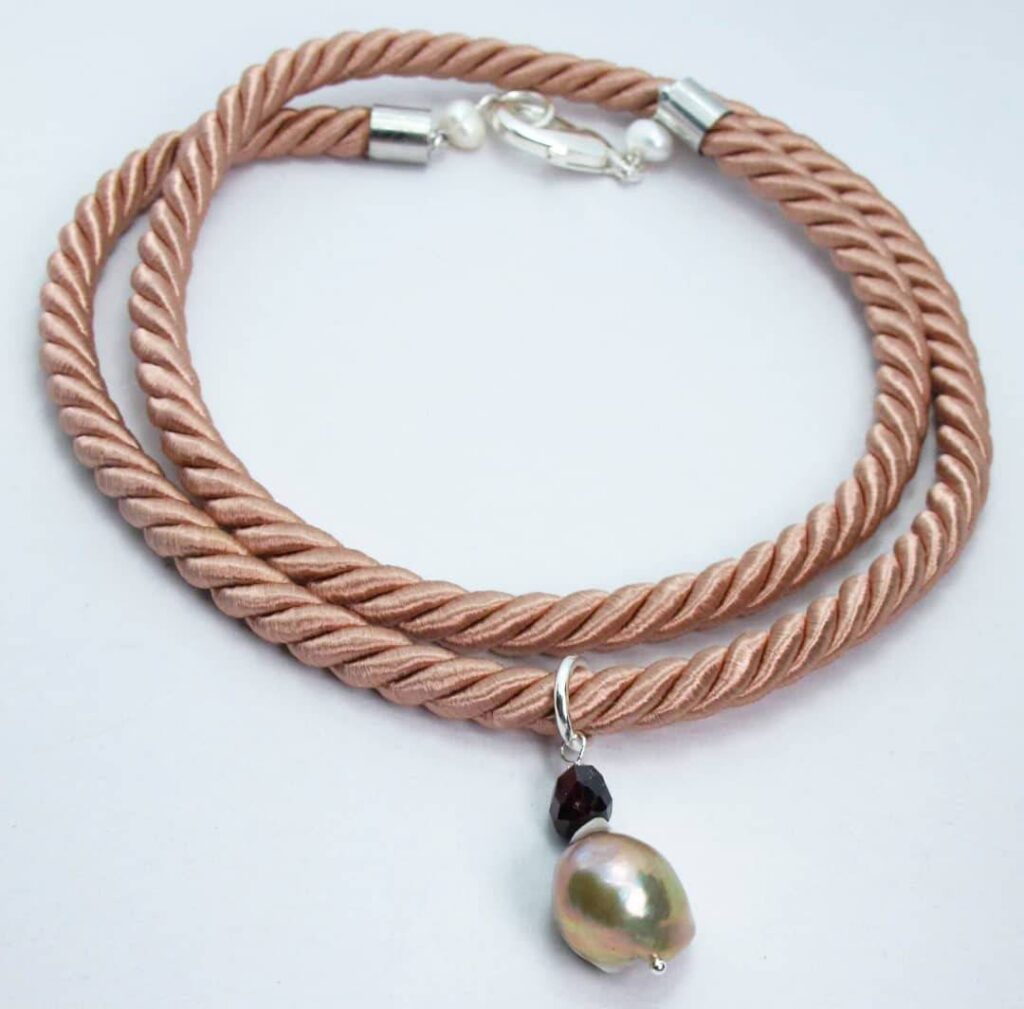 Pink silk necklace with big baroque pearl and garnet