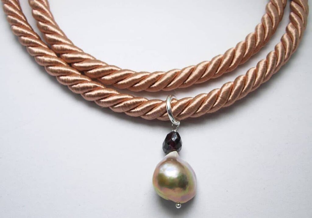 Pink silk necklace with big baroque pearl and garnet