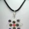 Black silk necklace with mother of pearl, amethyst, unakite, rhodocrosite cabochon and baroque freshwater pearls