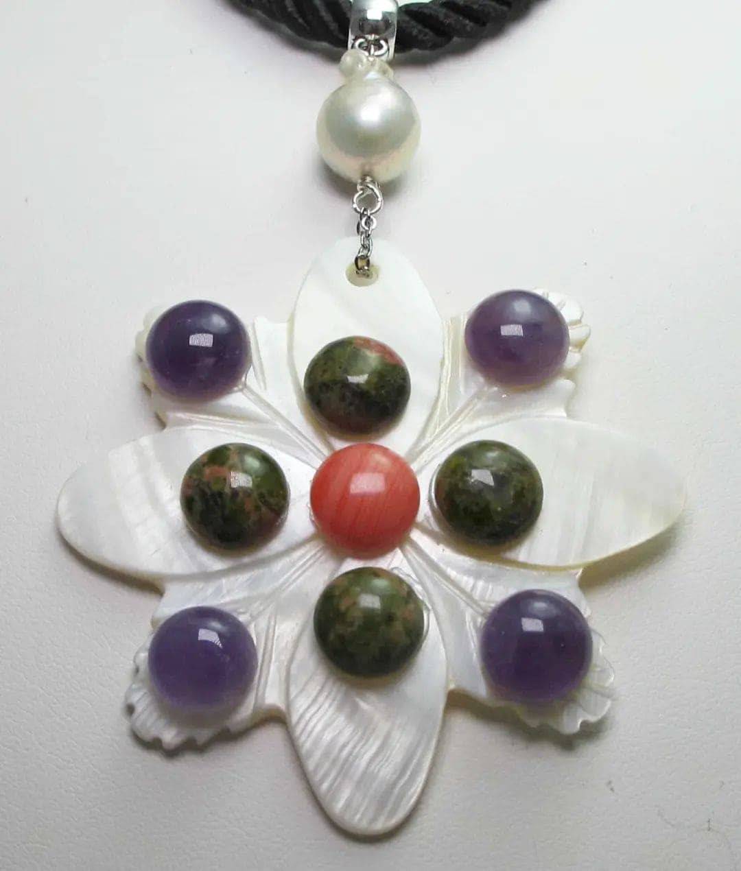 Black silk necklace with mother of pearl, amethyst, unakite, rhodocrosite cabochon and baroque freshwater pearls