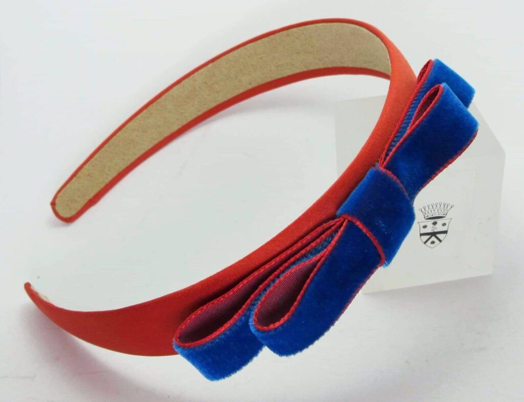 Light orange satin headband with electric blue velvet bow