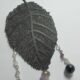 Pendant with pearl, lapis lazuli, jade African, agate, quartz and amethyst on a metal leaf