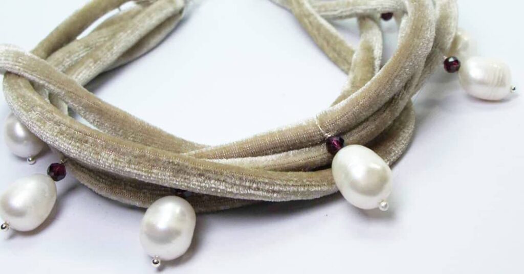 Multistrand velvet necklace with baroque pearls and rhodolite garnet